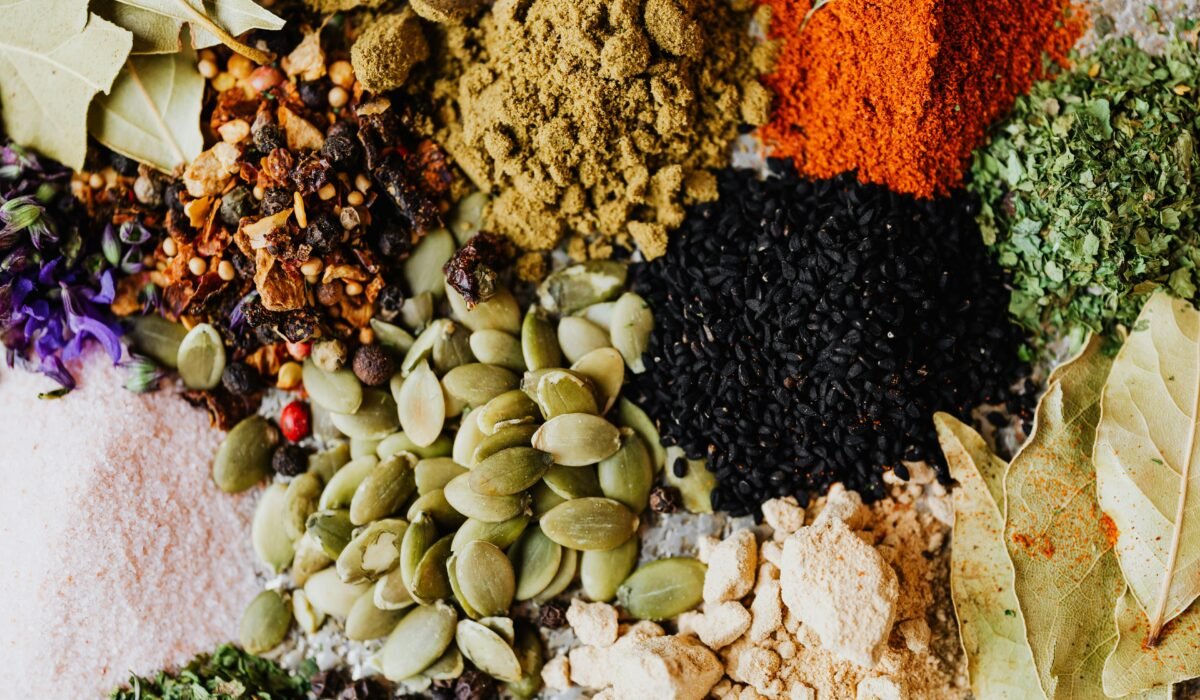 Vibrant collection of spices and seeds perfect for culinary backgrounds. — Photo by www.kaboompics.com on Pexels