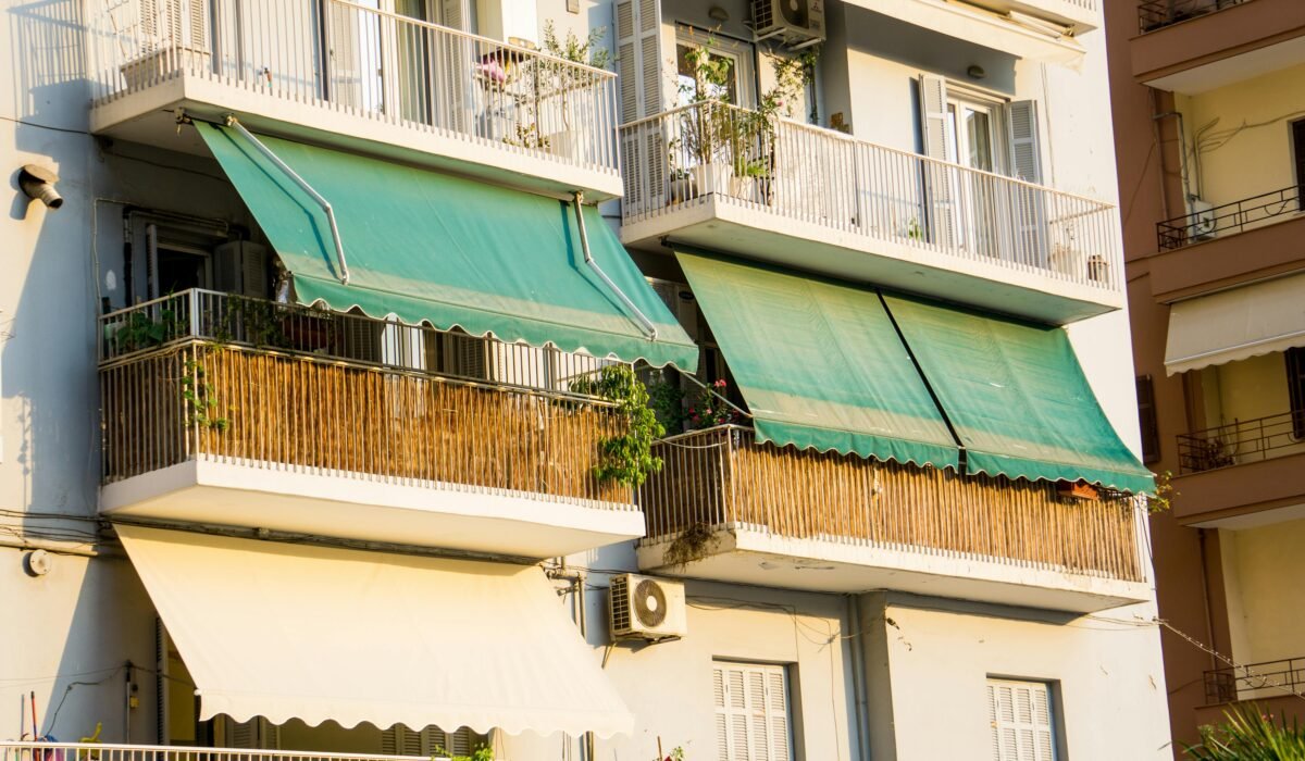 Close-up view of balconies with green awnings in Thessaloniki, Greece. — Photo by Ala J Graczyk on Pexels